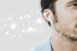 American man listening to music on wireless earphones digital remix